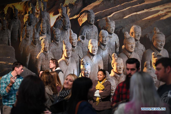 People wait to view terracotta warriors during a press preview at the Virginia Museum of Fine Arts (VMFA) in Richmond, Virginia, the United States, on Nov. 15, 2017. Titled Terracotta Army: Legacy of the First Emperor of China, the exhibition features more than 130 artifacts, including 10 life-size terracotta warriors. The exhibition will be at VMFA from Nov. 18 to March 11, 2018. (Xinhua/Yin Bogu)