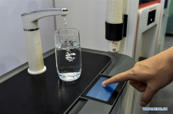 A water dispenser which can condense air moisture is seen during the 19th China High-tech Fair in Shenzhen, South China's Guangdong province, Nov 16, 2017. More than 3,000 exhibitors would show latest achievements in science and technology here on the fair which kicked off on Thursday. (Photo/Xinhua)