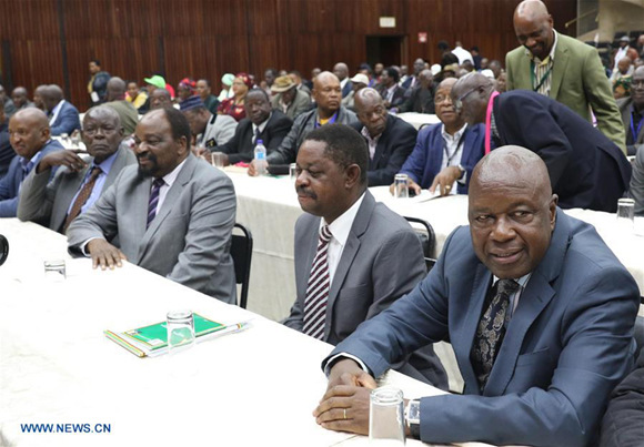 Members of Zimbabwe's ruling Zanu-PF party central committee attend a special meeting in Harare, capital of Zimbabwe, Nov. 19, 2017. Zimbabwe's ruling Zanu-PF party on Sunday recalled President Robert Mugabe from position of party leader, saying he must resign as president by noon Monday or impeachment proceedings will start. (Xinhua/Shaun Jusa)