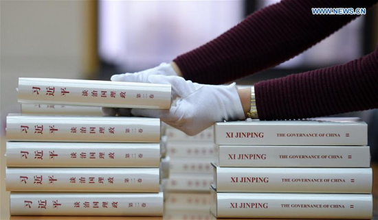 A worker from the Foreign Languages Press puts the second volume of Chinese President Xi Jinping's book Xi Jinping: The Governance of China in order, in Beijing, capital of China, Nov. 7, 2017. The second volume of Chinese President Xi Jinping's book on governance has been published in both Chinese and English, the publisher said Tuesday. (Xinhua/Chen Yehua)