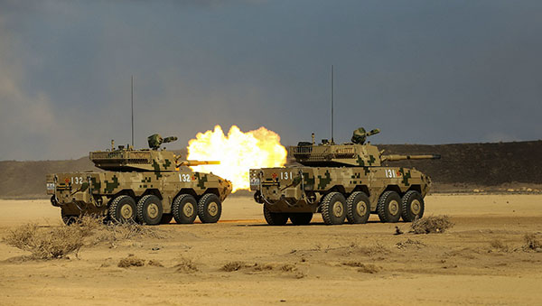 Tank destroyers from the People's Liberation Army's base in Djibouti participate in a live-fire exercise at a range in the African country's capital on Thursday. ZHANG QINGBAO/FOR CHINA DAILY