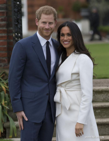 Prince Harry (L) and Meghan Markle attend an official photocall to announce their engagement in London, Britain, on Nov. 27, 2017. British royal family confirmed Monday that Prince Harry has already been engaged with his girlfriend Meghan Markle earlier this month in London. (Xinhua)