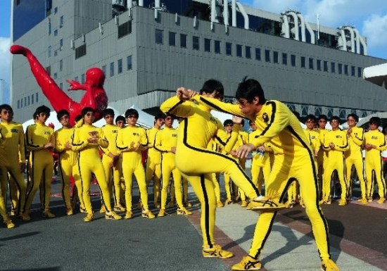 Fans of legendary kung fu movie star Bruce Lee perform in the World Expo Park in Shanghai, east China. /Xinhua Photo