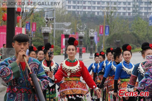 Jong May wearing a traditional Miao costume, welcomes visitors at the Wanda tourist resort in Danzhai county, Southwest China's Guizhou Province. Jong May was selected as cultural ambassador at the tourist resort under a promotion program starting in late June this year that invites people from across the world to serve on rotation basis. (Photo: China News Service/Wen Xinggui)