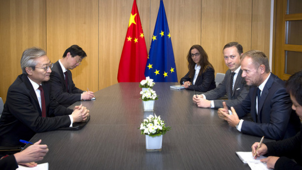 Zhang Ming, China's new ambassador to the EU, submitted his national credentials to European Council President Donald Tusk on Wednesday in Brussels. (Provided to China Daily)