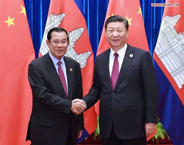 Chinese President Xi Jinping (R), also general secretary of the Communist Party of China (CPC) Central Committee, meets with President of the Cambodian People's Party and Cambodian Prime Minister Samdech Techo Hun Sen, who is here to attend the CPC in Dialogue with World Political Parties High-Level Meeting, in Beijing, capital of China, Dec. 1, 2017. (Xinhua/Rao Aimin)