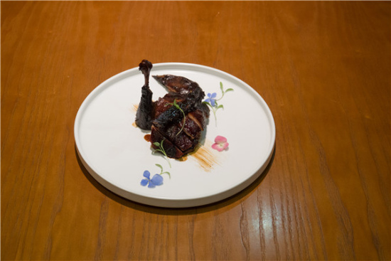 Dried soy-sauce duck by Dan Cha Fan restaurant. [Photo by Gao Erqiang/China Daily]