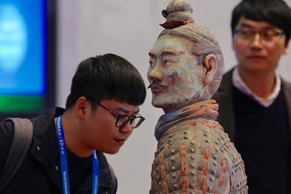 A 3D-printed terra cotta warrior is displayed at the conference. (Photo by Zhu Xingxin/China Daily)