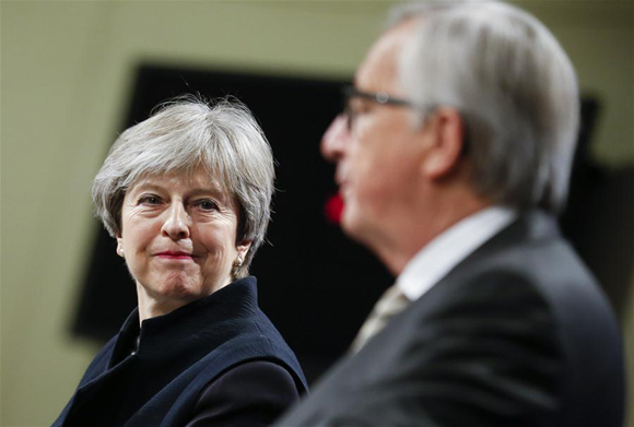 British Prime Minister Theresa May (L) and European Commission President Jean-Claude Juncker attend a press conference after their meeting on Brexit at EU headquarters in Brussels, Belgium, on Dec. 4, 2017. Despite continuous efforts and growing common grounds of Britain and the European Union, it was not possible to reach a complete agreement Monday, said Jean-Claude Juncker in a hastily arranged press conference with visiting British Prime Minister Theresa May. (Xinhua/Ye Pingfan)