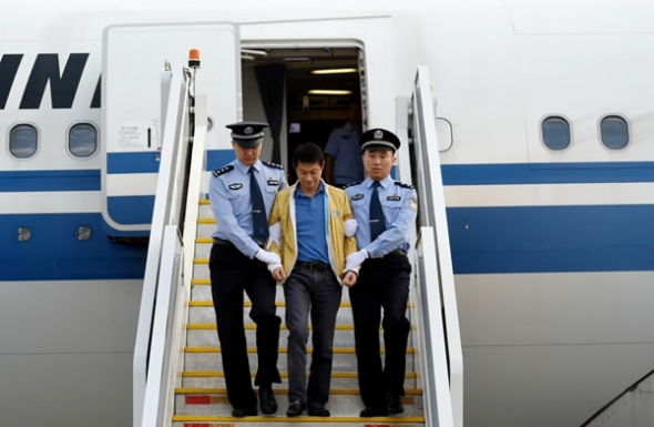 A man listed as China's most-wanted overseas fugitive is repatriated to Beijing, July 29, 2017.  (File photo/CCDI)
