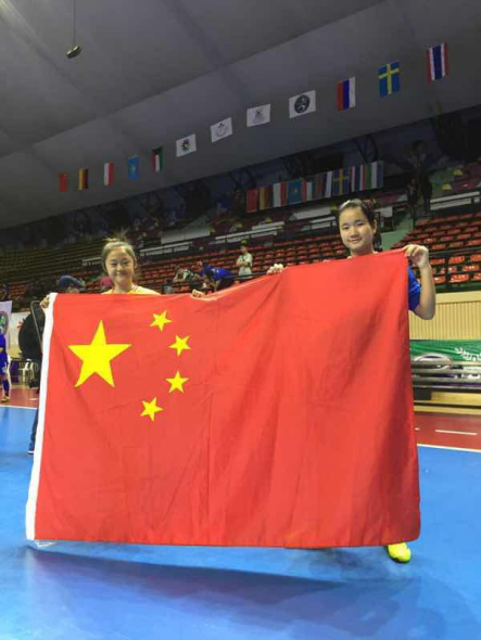 Huang Ting and Li Fangshu pose for a photo after winning the final match of the First U18 Deaf Indoor Futsal Football Championship. Photo/chinadaily.com.cn