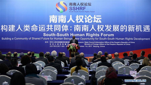 Willy Nyamttwe, principal counsellor in charge of press, information and communication of the Presidency of the Republic of Burundi, announces the Beijing Declaration at the South-South Human Rights Forum in Beijing, capital of China, Dec. 8, 2017. (Xinhua/Jin Liwang)