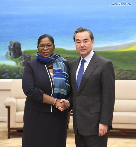 Chinese Foreign Minister Wang Yi (R) meets with Suriname Foreign Minister Yldiz Pollack-Beighle, who is here to attend the first South-South Human Rights Forum, in Beijing, capital of China, Dec. 7, 2017. (Xinhua/Zhang Ling)