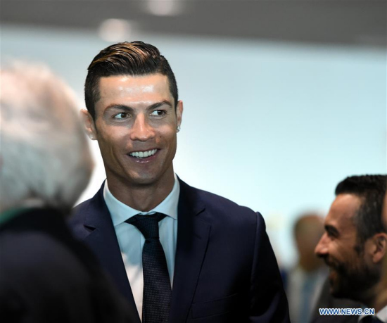 Portuguese footballer Cristiano Ronaldo attends an airport renaming ceremony in Funchal March 29, 2017. Portugal on Wednesday renamed Madeira airport as Cristiano Ronaldo airport in honor of the captain of the Portuguese national football team. Funchal on Madeira Islands is the hometown of Cristiano Ronaldo. (Xinhua file photo/Zhang Liyun)