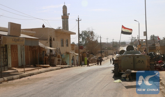 A military vehicle is seen inside the liberated city of Rawa near the Iraqi border with Syria, on Nov. 18, 2017. Iraqi security forces battling Islamic State (IS) militants freed Friday the city of Rawa near the border with Syria, dislodging the extremist militants from their last urban stronghold in Iraq, the Iraqi military said. (Xinhua Photo)