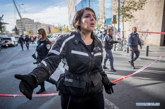 Israeli police guard the site of a knife attack at Jerusalem's central bus station, on Dec. 10, 2017. An Israeli security guard was seriously wounded Sunday by a Palestinian knifeman outside Jerusalem's central bus station, the police said. (Xinhua/JINI)
