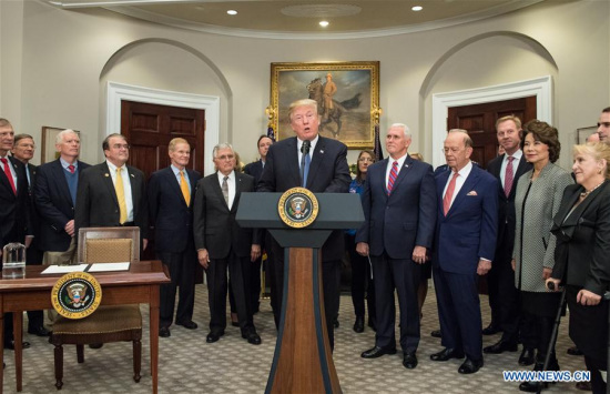 Photo released by NASA on Dec. 11, 2017 shows U.S. President Donald Trump (C) speaking before signing the Space Policy Directive 1 at the White House in Washington D.C., the United States. (Xinhua/NASA/Aubrey Gemignani)