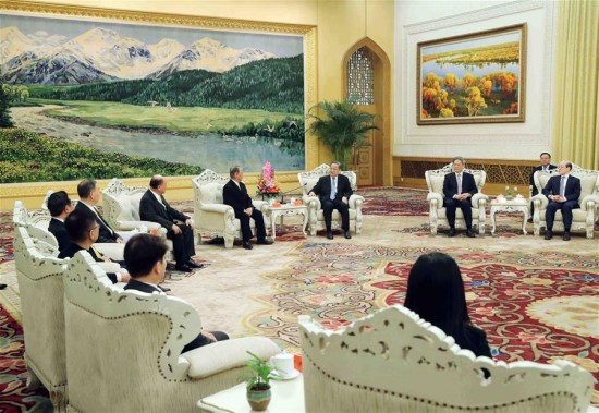 Yu Zhengsheng, chairman of the National Committee of the Chinese People's Political Consultative Conference, meets a delegation led by Yok Mu-ming, chairman of Taiwan's New Party, in Beijing, capital of China, Dec. 11, 2017. (Xinhua/Liu Weibing)
