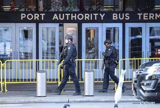 Police officers work near the scene of an explosion in New York City, the United States, on Dec. 11, 2017. Four people were injured in an explosion in a passageway near Times Square, Manhattan in New York City early Monday morning. (Xinhua/Wang Ying)