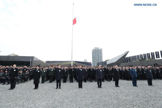 Chinese President Xi Jinping (4th L, front), and Yu Zhengsheng (4th R, front), chairman of the National Committee of the Chinese People's Political Consultative Conference, attend a state memorial ceremony to mark the 80th anniversary of the Nanjing Massacre in Nanjing, capital of east China's Jiangsu Province, Dec. 13, 2017. (Xinhua/Xie Huanchi)
