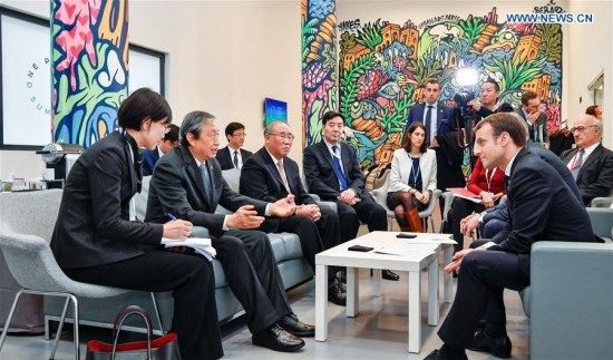 French President Emmanuel Macron (Front R) meets with Ma Kai, Chinese Vice Premier and the special envoy of President Xi Jinping, in Paris, France, on Dec. 12, 2017. French President Emmanuel Macron on Tuesday met with Chinese Vice Premier Ma Kai, who was in Paris to attend the One Planet Summit as the special envoy of President Xi Jinping. (Xinhua/Chen Yichen)