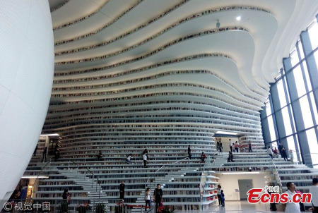 The Binhai New Area library, touted as the 'eye of Binhai', has become a new cultural landmark and tourist destination in Tianjin C the municipality neighboring Beijing. Inaugurated on the National Day earlier this month, the library rose to fame on Chinese social media this week as photos of its modern and magnificent design circulated widely online. The photos have been reposted and liked over 100,000 times on Sina Weibo, China's Twitter equivalent. (Photo/VCG)