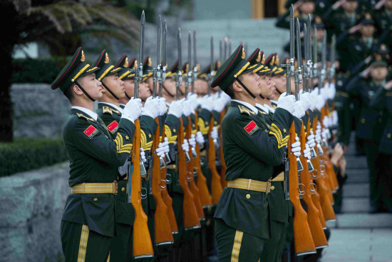 The PLA force stationed in Macao holds flag-rising ceremony to celebrate the 18th anniversary of Macao's return to China. /CGTN Photo