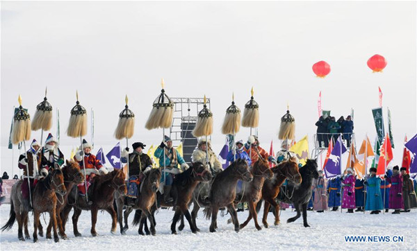 Herdsmen take part in a sacrificial ceremony at the opening ceremony of a winter Nadam fair in Chen Barag Qi of the Hulun Buir, north China's Inner Mongolia Autonomous Region, Dec. 23, 2017. Nadam Fair, meaning entertainment or recreation in Mongolian, is a mass traditional Mongolian festival mainly filled with sports events. (Xinhua/Liu Lei)
