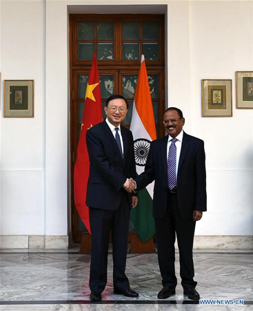 Chinese State Councilor Yang Jiechi (L) shakes hands with Indian National Security Adviser Ajit Doval in New Delhi, India, Dec. 22, 2017. Senior officials of China and India have agreed to properly handle border issues so as to jointly safeguard peace and tranquility in their border areas. (Xinhua/Zhang Naijie)
