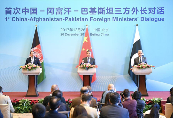 Chinese Foreign Minister Wang Yi (C), Afghan Foreign Minister Salahuddin Rabbani (L) and Pakistani Foreign Minister Khawaja Muhammad Asif, meet the press after the 1st China-Afghanistan-Pakistan Foreign Ministers' Dialogue, in Beijing, capital of China, Dec. 26, 2017. (Xinhua/Yan Yan)