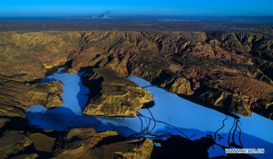 Photo taken on Dec. 16, 2017 shows Longzhou Danxia landform in Jingbian County of Yulin City, northwest China's Shaanxi Province. (Xinhua/Tao Ming)
