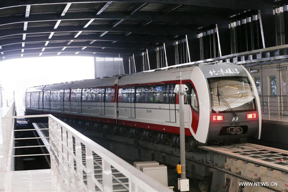 A train runs on the Line S1 in Beijing, capital of China, Dec. 30, 2017. The 10.2-km Line S1 is Beijing's first medium-low speed maglev line. It connects the western suburban districts of Mentougou and Shijingshan. Three more subway lines, which are Yanfang Line, Line S1 and West Suburb Line, started operation in Beijing Saturday, bringing the total length of metros in the Chinese capital to 608 kilometers. (Xinhua/Chen Xiaogen)