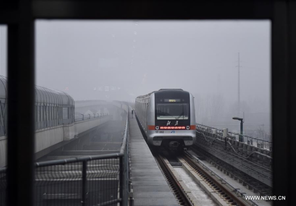 A train runs on Yanfang subway line in Beijing, capital of China, Dec. 30, 2017. Yanfang line started trial operation on Saturday. Located in Beijing's southwest suburbs, the Yanfang Line is China's first fully domestically developed automated subway. It has nine stations on its 14.4-km main line, linking the areas of Yanshan and Fangshan. The line is expected to carry 70,000 passengers daily. (Xinhua/Luo Xiaoguang)