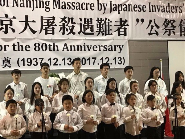 Ontarians attend a memorial that commemorates the 80th anniversary of the Nanjing Massacre in Toronto, Canada, on Dec 13, 2017. (Photo provided to chinadaily.com.cn)