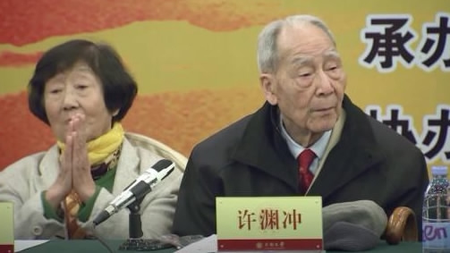 File photo of Xu Yuanchong (R), a well-known Chinese translator. (Photo/CGTN)