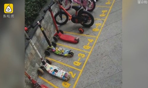 Pictured are numbered parking spaces outside the school. (Screenshot photo)