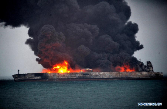 The Panama-registered oil tanker is seen on fire in waters about 160 sea miles east of the Yangtze River's estuary, Jan. 7, 2018. Thirty-two crew members, including 30 Iranians and two Bangladeshis, have gone missing after two vessels collided off China's east coast on Saturday evening, China's Ministry of Transport said Sunday. (Xinhua)