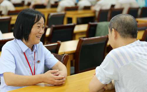 Xu Hui, 54, is director of a legal assistance center in Tongcheng county, Hubei province. (Photo provided to China Daily)