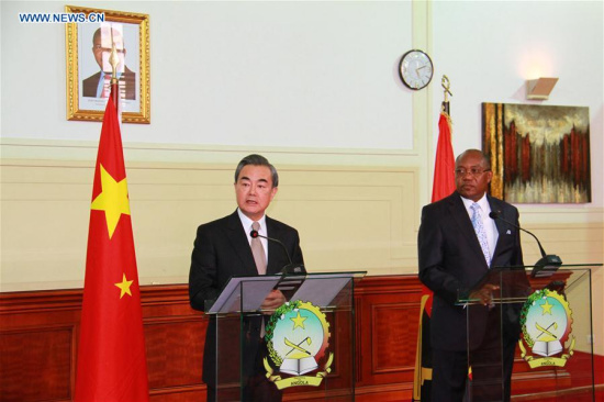 Chinese Foreign Minister Wang Yi (L) attends a joint press conference with his Angolan counterpart Manuel Domingos Augusto after their meeting in Luanda, Angola, on Jan. 14, 2018. Chinese Foreign Minister Wang Yi on Sunday called for the transformation and upgrade of cooperation with Angola. (Xinhua/Wu Changwei)