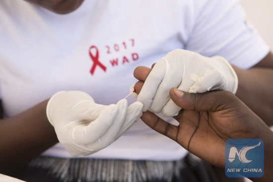 A person receives a free HIV test during the World AIDS Day activities in Kigali, Rwanda, on Dec. 1, 2017. (Xinhua/Gabriel Dusabe)