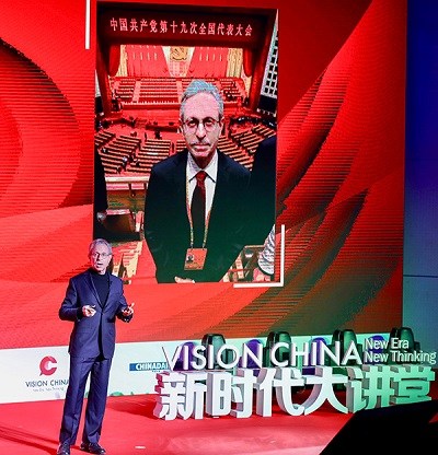 Robert Lawrence Kuhn, a U.S. specialist on China, speaks at the inaugural Vision China event on Monday at the University of International Business and Economics in Beijing. (Photo by Zhu Xingxin/China Daily)