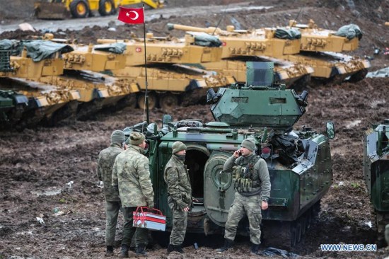 Turkish soldiers are seen with their armored vehicles near Turkish-Syrian border in Hatay, Turkey, on Jan. 23, 2018. (Xinhua)