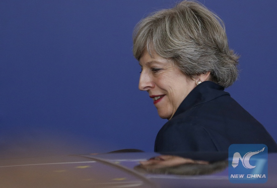 British Prime Minister Theresa May leaves the EU headquarters after the first day of the two-day EU summit in Brussels, Belgium, early Oct. 20, 2017. (Xinhua/Ye Pingfan)