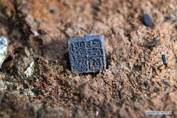 Photo taken on Jan. 25, 2018 shows the metal seal reading Liu Chongguo unearthed from the No. 5 tomb of the Marquis of Haihun site in Nanchang, east China's Jiangxi Province. 
