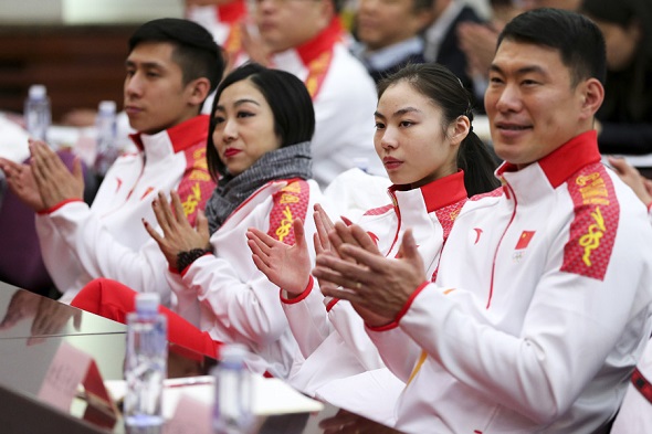 Figure skater Yu Xiaoyu (second from the right) applauds at the unveiling ceremony of the Chinese delegation to the 2018 Winter Olympic Games in Beijing, Jan 31, 2018. (Photo by Feng Yongbin/chinadaily.com.cn)