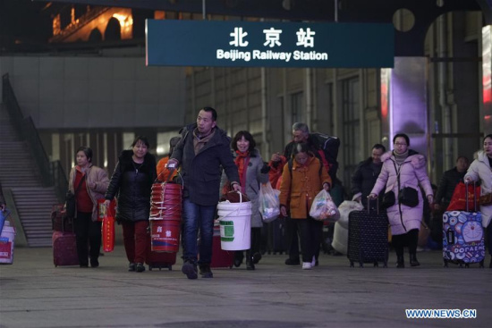 Passengers prepare to take the train at Beijing Railway Station in Beijing, capital of China, Feb. 1, 2018. The 2018 Spring Festival travel rush, known as the Chunyun, started on Thursday and will last till March 12. About 2.98 billion trips are expected to be made during the Chunyun. The Spring Festival, or Chinese Lunar New Year, falls on Feb. 16 this year. (Xinhua/Xing Guangli)