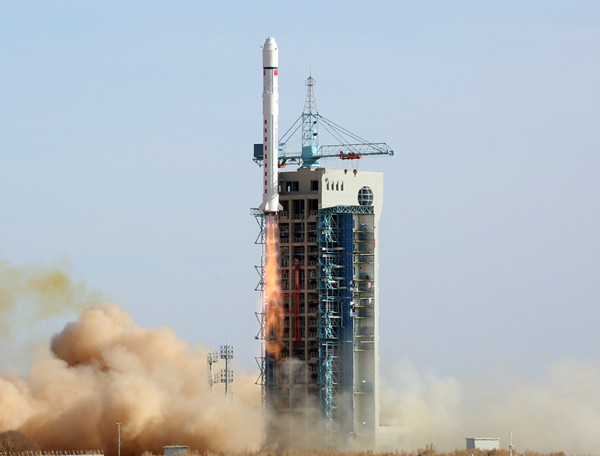 A Long March 2D rocket carrying several satellites is launched on Friday. LI SHENGCHENG / FOR CHINA DAILY 