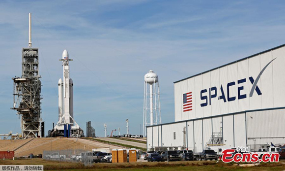 SpaceX is set to launch its long-awaited Falcon Heavy rocket  described as the most powerful operational rocket in the world by a factor of two from Kennedy Space Center in Florida, Feb. 6, 2018, with a 2.5-hour launch window. Thousands of excited viewers are already lining up along the Florida coast to witness the event. The rocket will be carrying a red Tesla Roadster. (Photo/Agencies)