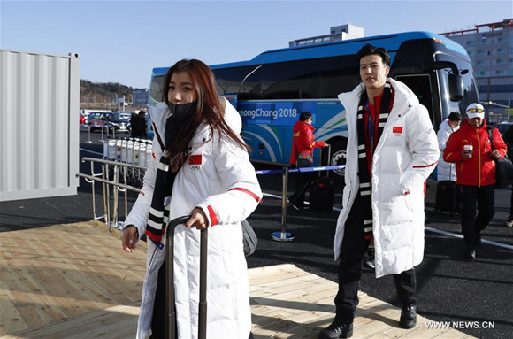 Wang Shiyue (1st L) and Liu Xinyu (2nd L), China's figure skaters arrive at Olympic Village in Gangneung, South Korea, Feb. 6, 2018. The 2018 PyeongChang Olympic Winter Games will kick off here on Feb. 9. (Xinhua/Han Yan)