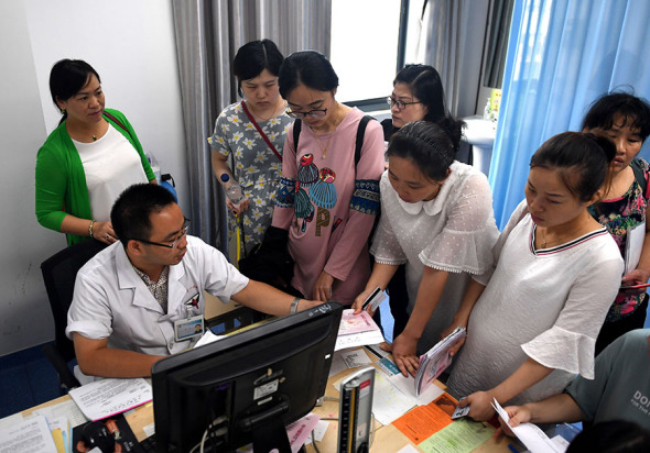 Women wait for prenatal checkups at a hospital in Hefei, Anhui province, on Dec 4. LIU JUNXI/XINHUA